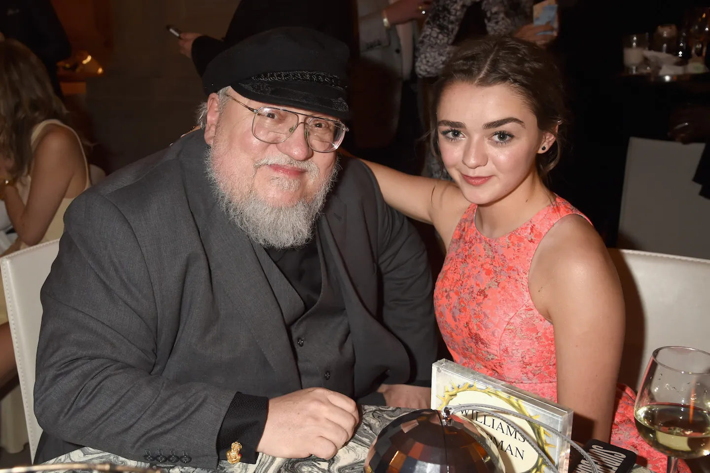 George R. R. Martin and Maisie Williams.