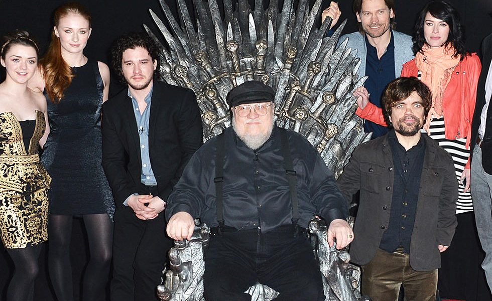 game of thrones george rr martin on iron throne