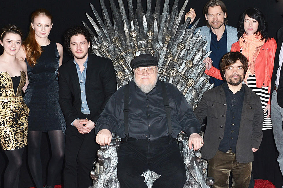 game of thrones george rr martin on iron throne
