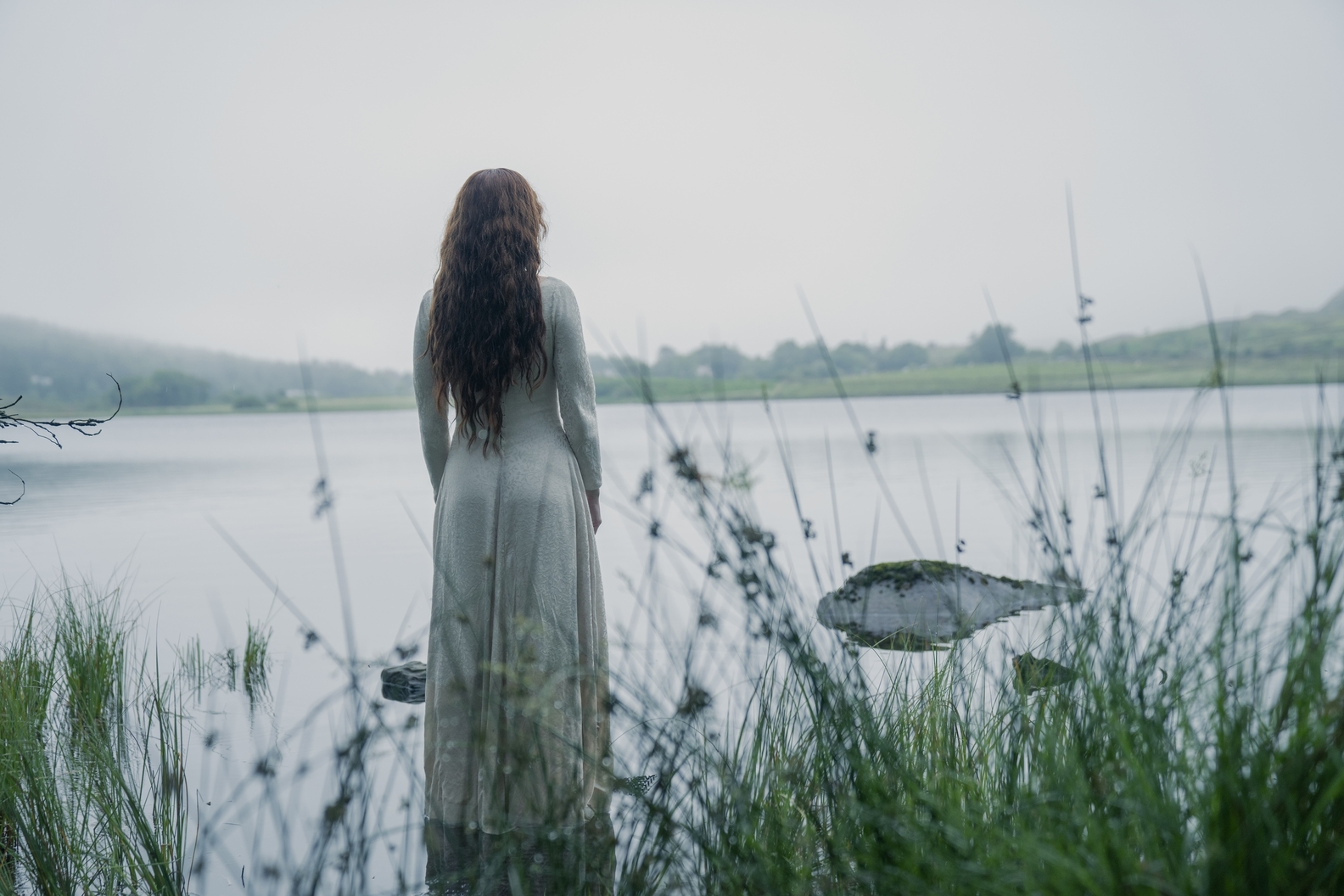 Alicent on the shore of a creek